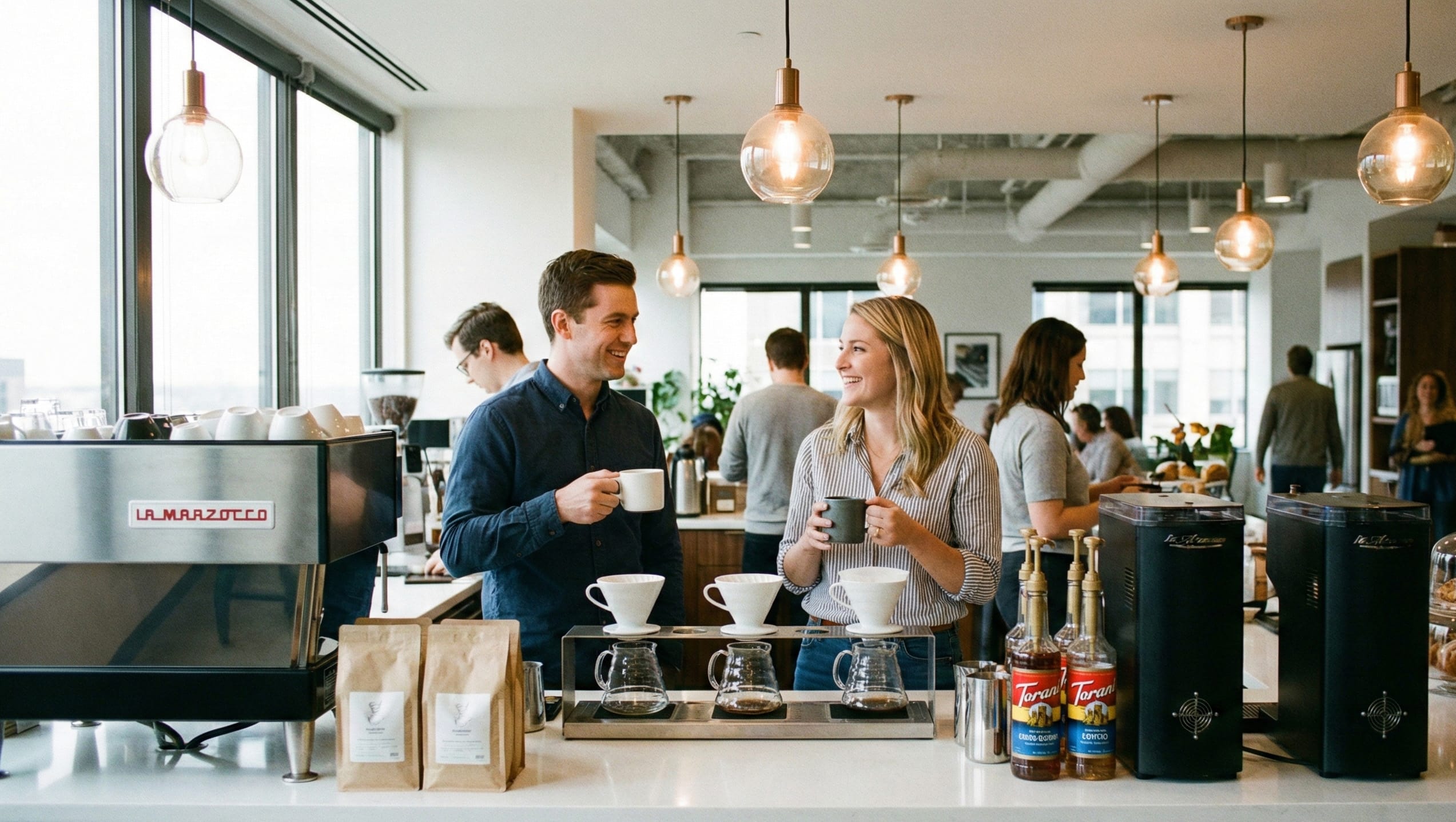 two coworkers enjoying coffee in building